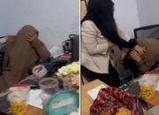 Tangkapan layar video menunjukkan istri sah melabrak wanita bercadar yang diduga selingkuhan suaminya di Makassar.